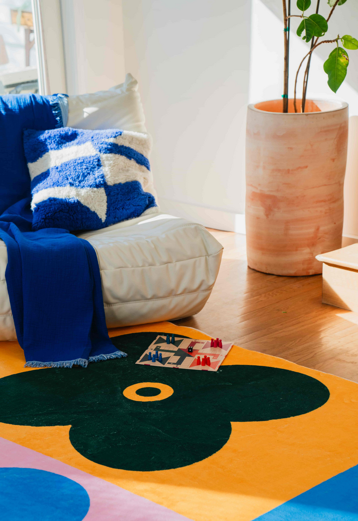 LanySpace Multicolor Four Leaf Clover Rug under a couch