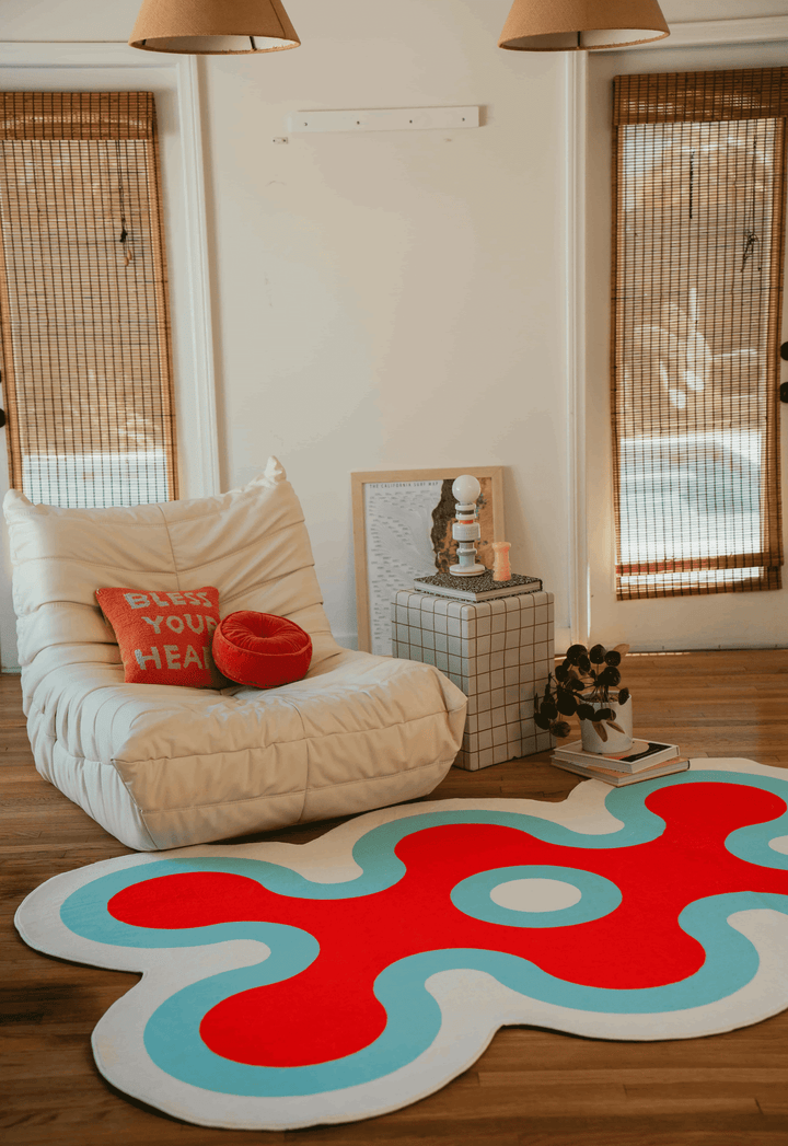 LanySpace Irregular Coral Design Rug in Pink, before a couch