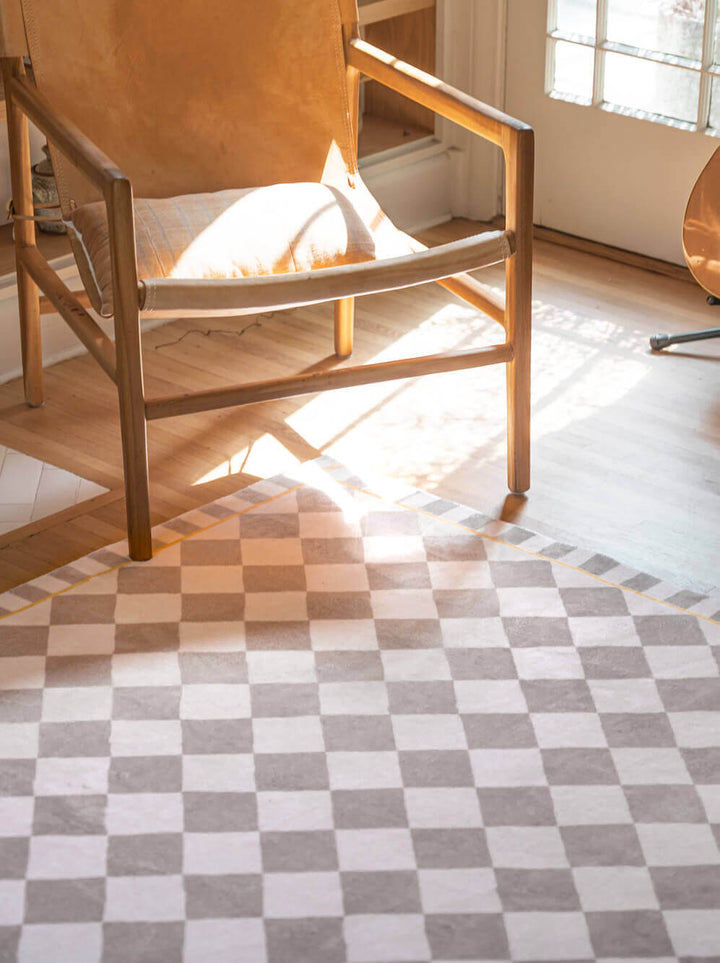 A retro chair on LanySpace Beige & Cream Checkered Rug