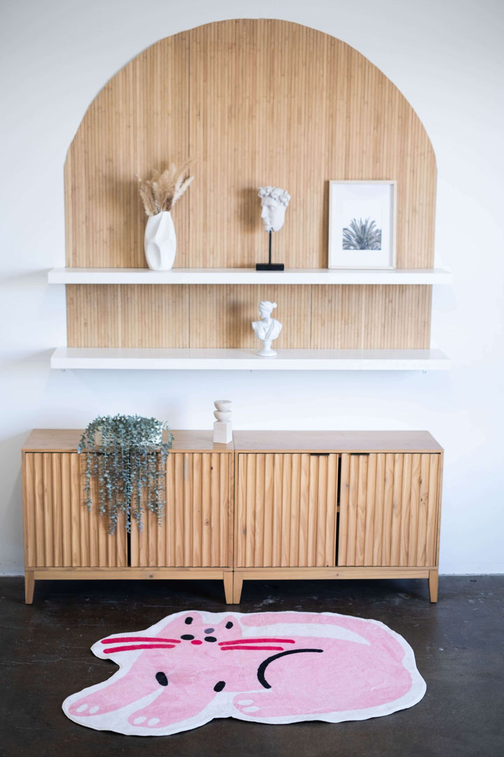 LanySpace Pink Cat Print Rug next to cabinet