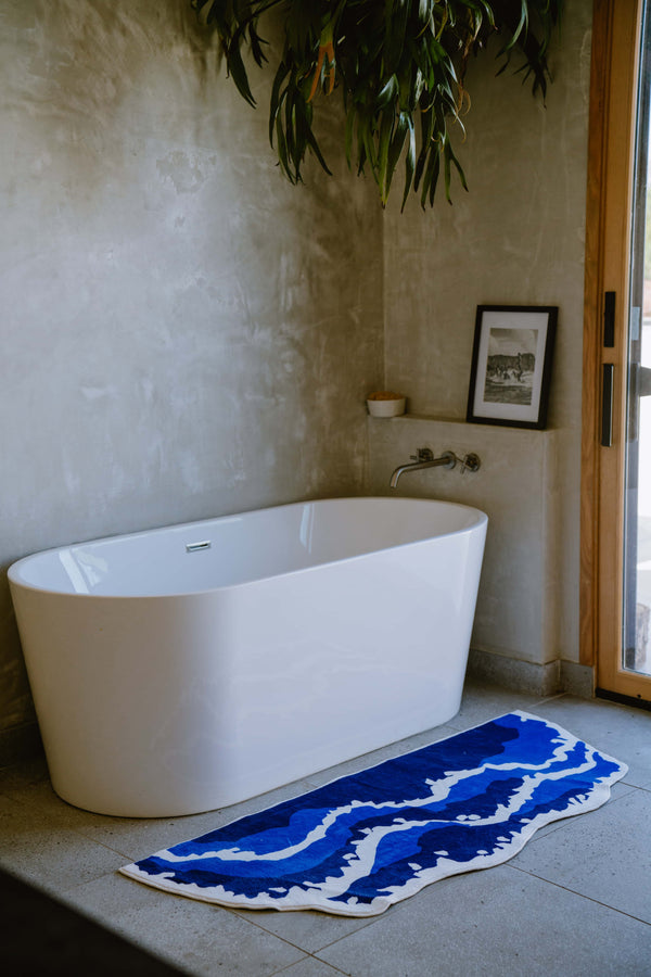 LanySpace Irregular Shaped Blue Wavy Runner Beside the Bathtub