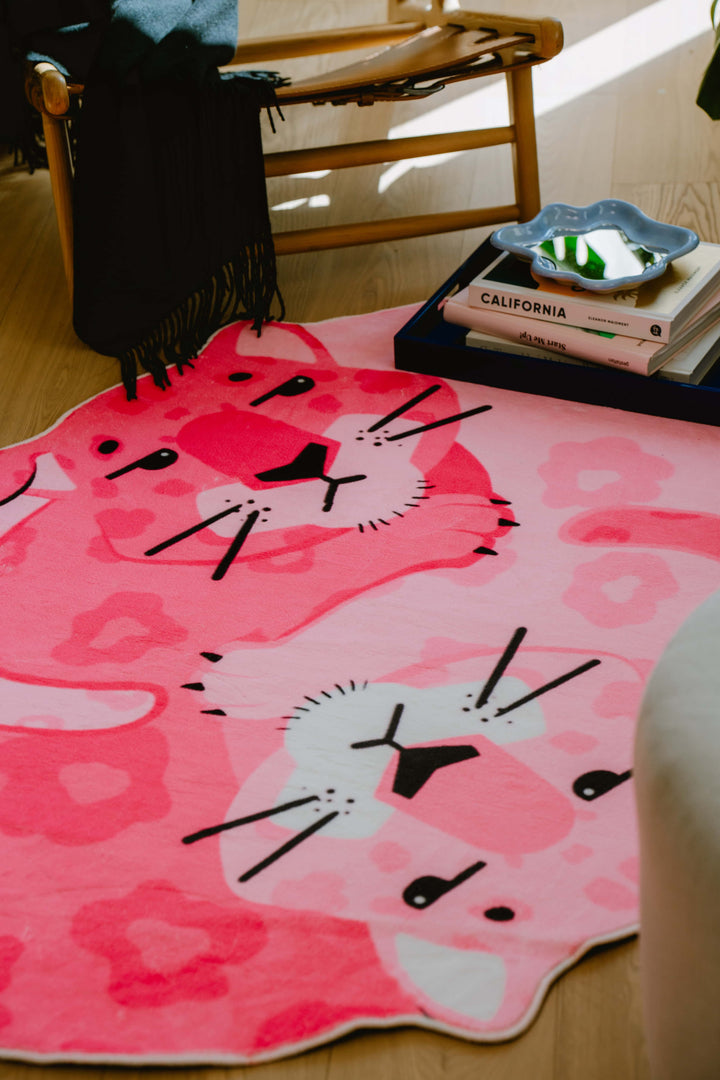 Cozy Reading on LanySpace Designer Pink Panther Area Rug